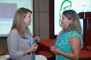 Laura Broyles and Debi Boeras in discussion at the EMTCT workshop